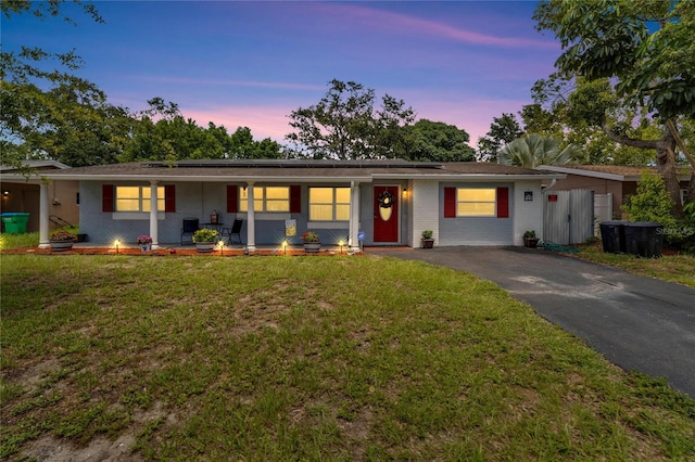 ranch-style house with a lawn