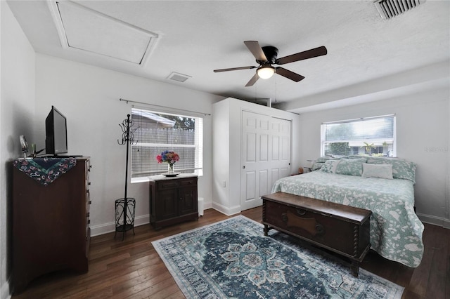 bedroom featuring a closet, ceiling fan, and dark hardwood / wood-style flooring