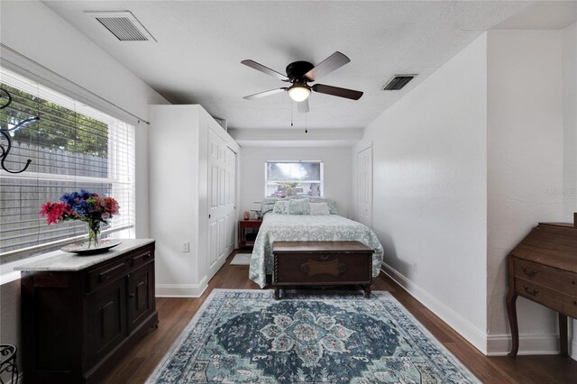 bedroom with dark wood-type flooring and ceiling fan