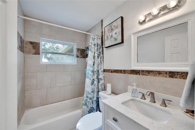 full bathroom with tile walls, vanity, shower / tub combo, and toilet