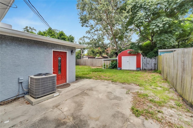 view of patio / terrace with a storage shed and cooling unit