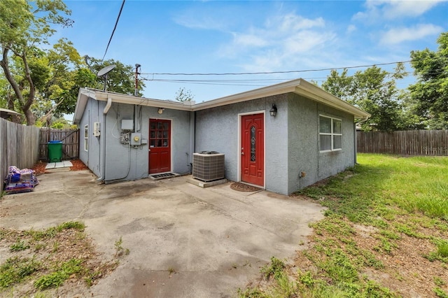 view of outbuilding with a yard and central AC