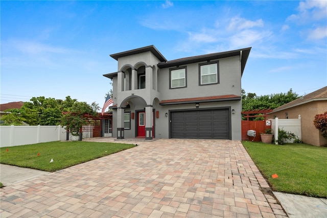 view of front of property with a front lawn and a garage