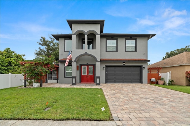 view of front of house featuring a front yard, french doors, and a garage