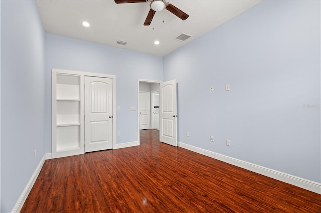 unfurnished bedroom with hardwood / wood-style floors, a closet, and ceiling fan