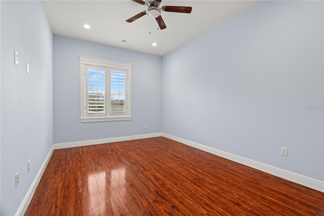 empty room with ceiling fan and wood-type flooring