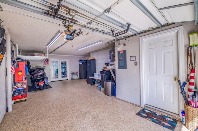 garage with electric panel and a garage door opener