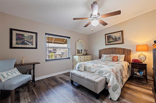 bedroom with dark hardwood / wood-style flooring, ceiling fan, a textured ceiling, and lofted ceiling