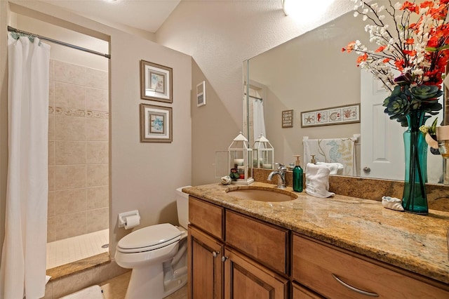 bathroom with tile patterned floors, vanity, a shower with shower curtain, and toilet