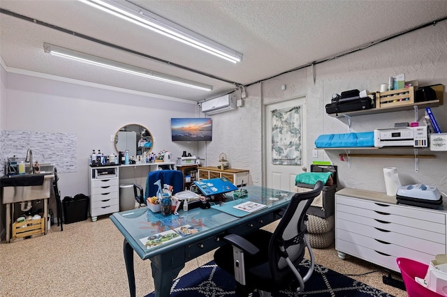 office space featuring a wall unit AC and a textured ceiling