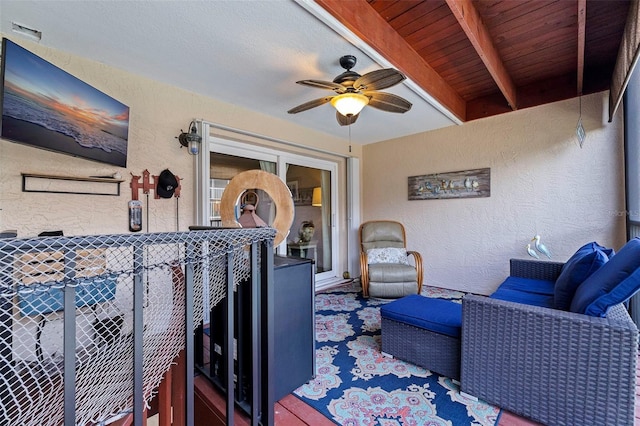 view of patio / terrace with ceiling fan and a balcony