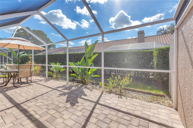 view of patio with a lanai