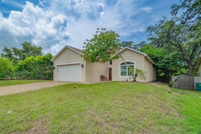 ranch-style home featuring a garage and a front lawn