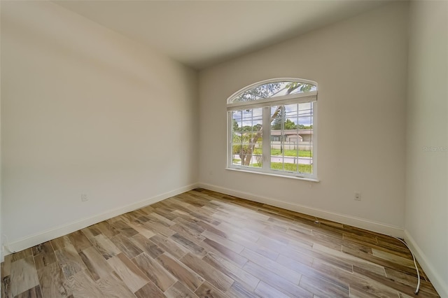 spare room featuring light hardwood / wood-style floors