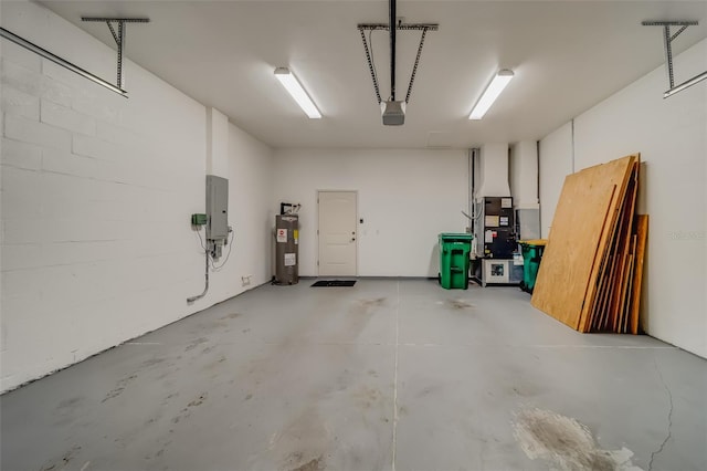 garage featuring electric water heater and electric panel