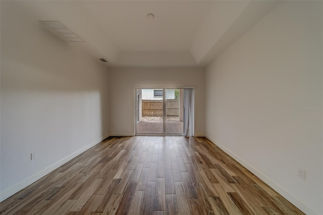 empty room with wood-type flooring