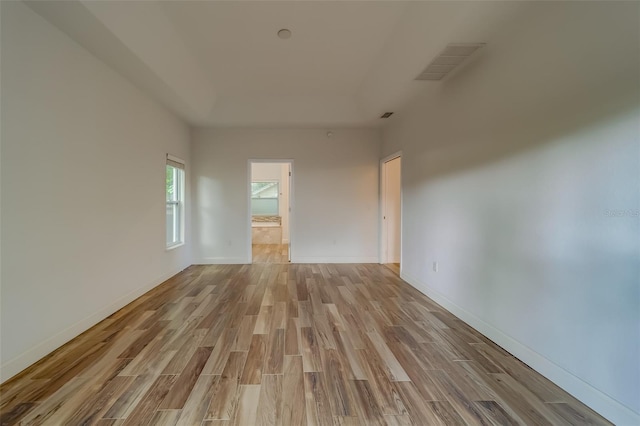 spare room with light hardwood / wood-style flooring