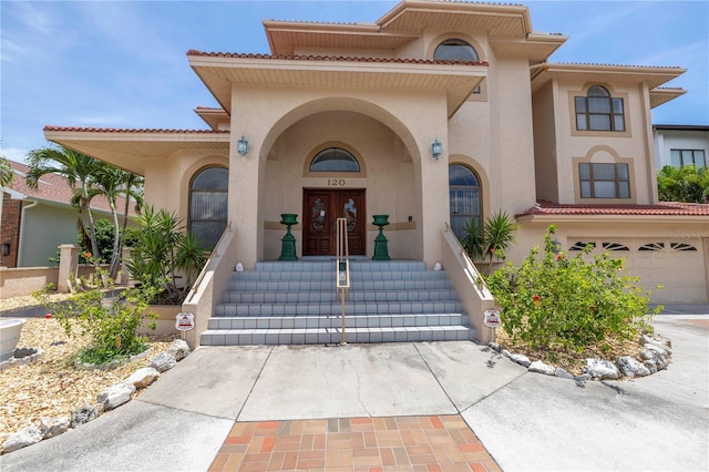 doorway to property featuring a garage