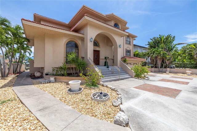 mediterranean / spanish house featuring a garage