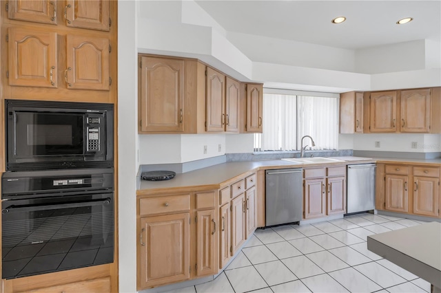 kitchen with sink, black appliances, and light tile patterned flooring