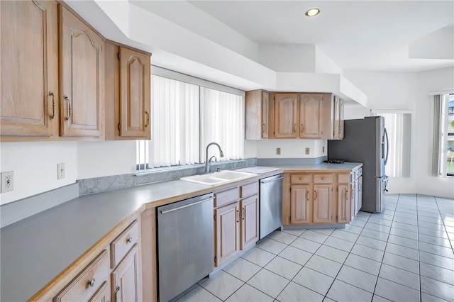 kitchen featuring light tile patterned flooring, appliances with stainless steel finishes, sink, and light brown cabinets