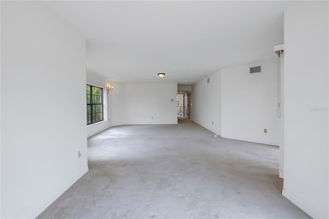 empty room featuring light carpet