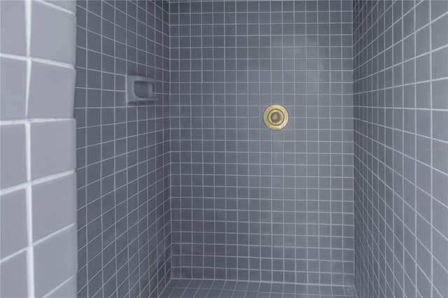 bathroom with tiled shower