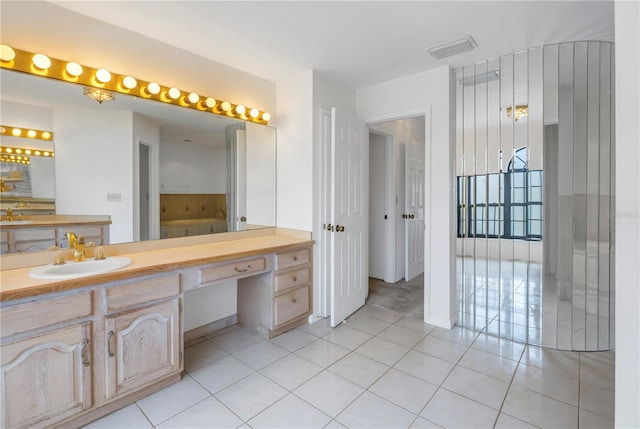 bathroom with vanity and tile patterned flooring