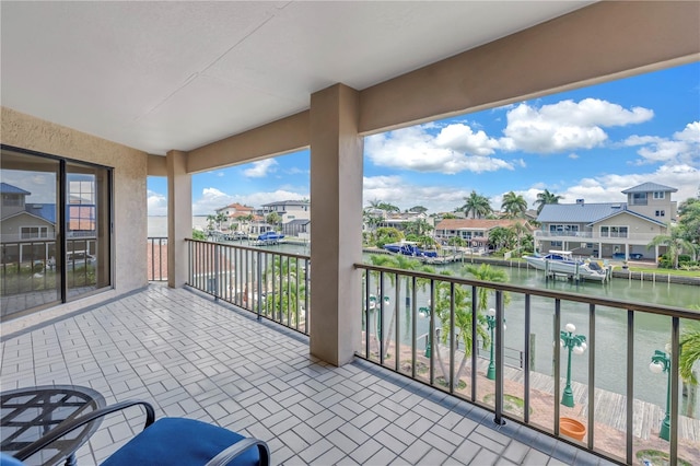 balcony featuring a water view