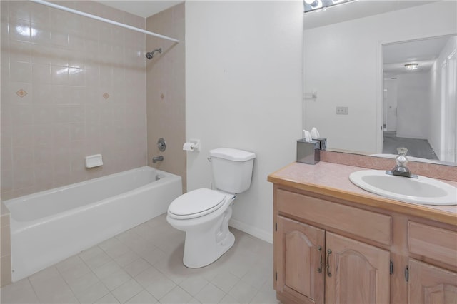 full bathroom with vanity, tiled shower / bath, tile patterned floors, and toilet