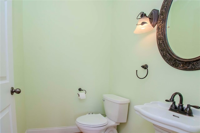 bathroom with sink and toilet