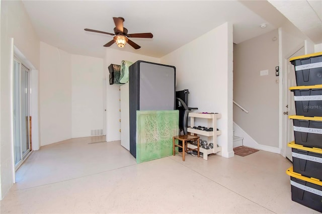 interior space with ceiling fan