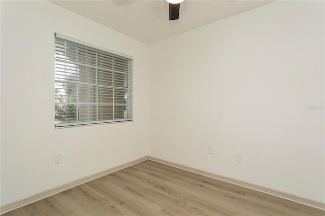 empty room featuring ceiling fan and light wood-type flooring