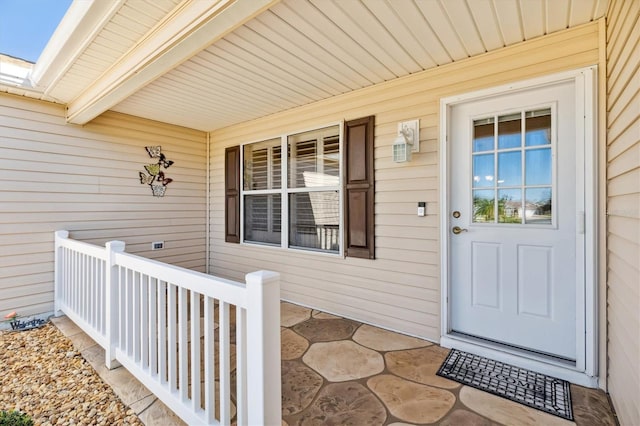 property entrance featuring a porch