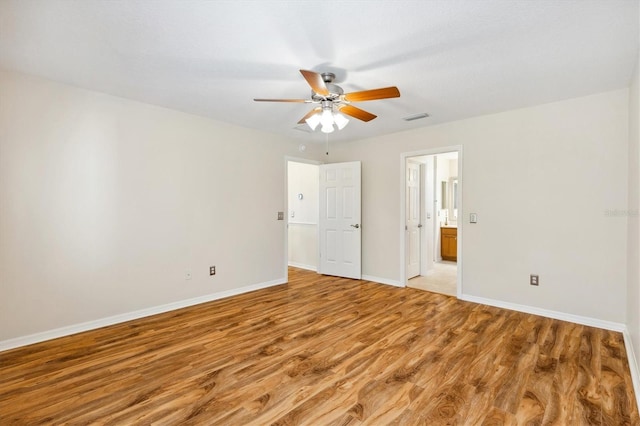 unfurnished bedroom with hardwood / wood-style floors and ceiling fan