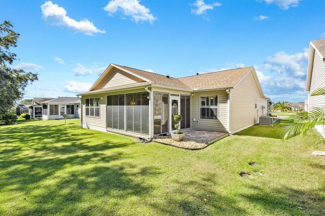 back of house with a patio, cooling unit, a lawn, and a sunroom