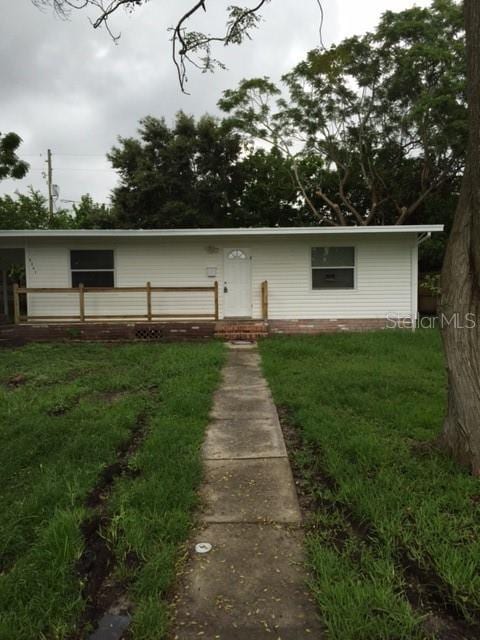 back of house with a yard