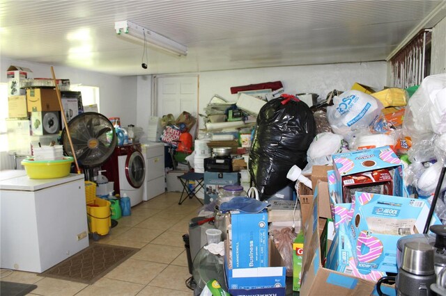 garage with fridge and washer and dryer