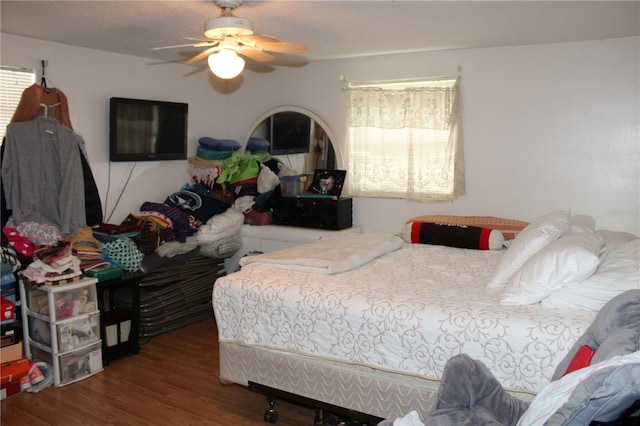 bedroom featuring hardwood / wood-style floors and ceiling fan