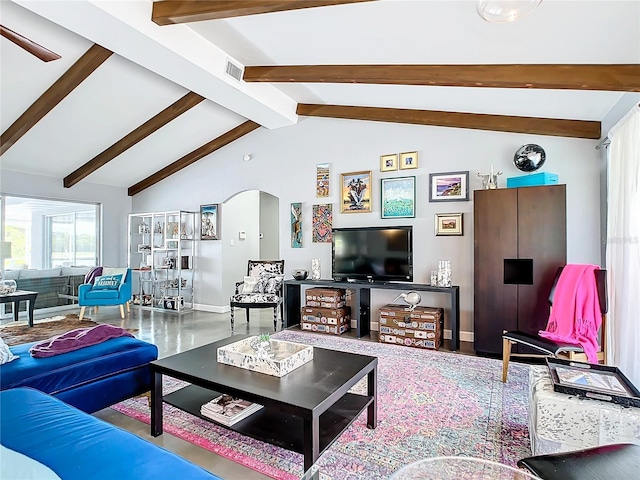 living room featuring vaulted ceiling with beams