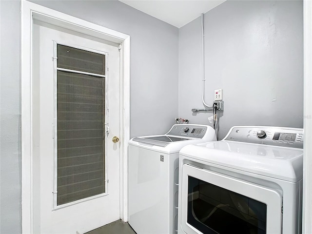 washroom with separate washer and dryer