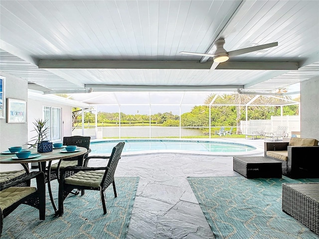 view of swimming pool with a patio, ceiling fan, and a lanai