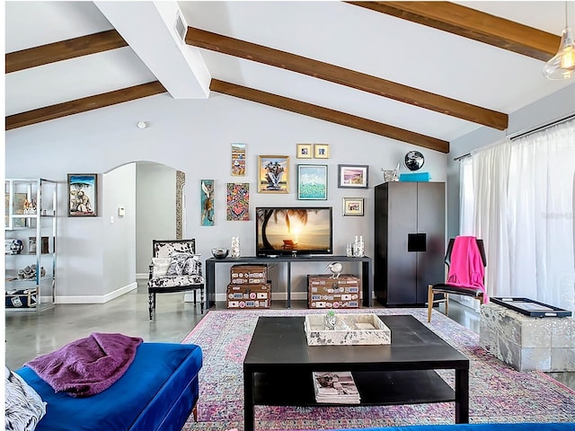 living room featuring concrete flooring and vaulted ceiling