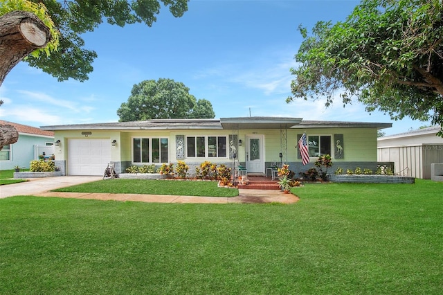 single story home with a front lawn and a garage