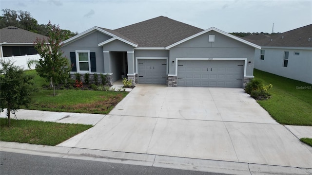 view of front facade featuring a garage and a front yard