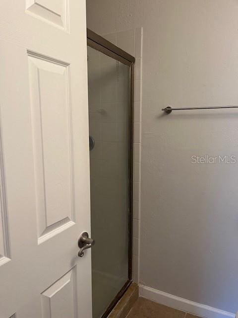 bathroom with an enclosed shower