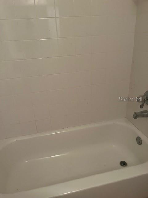 bathroom featuring a tub to relax in