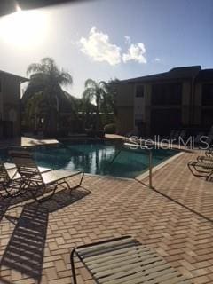 view of swimming pool featuring a patio