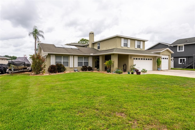 view of front of home featuring a front yard and a garage