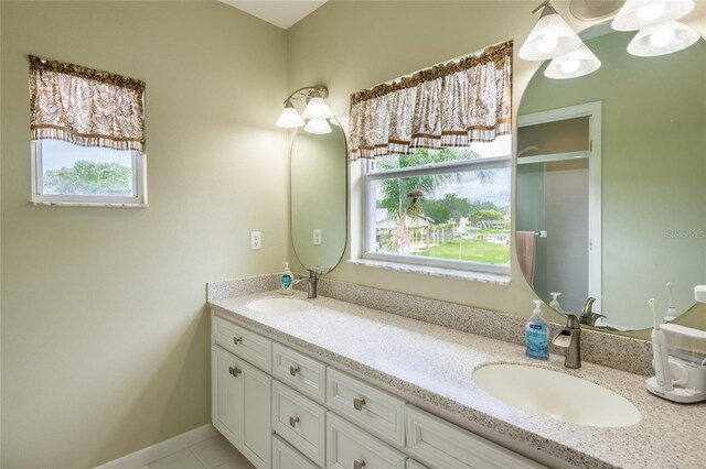 bathroom with tile patterned flooring and vanity